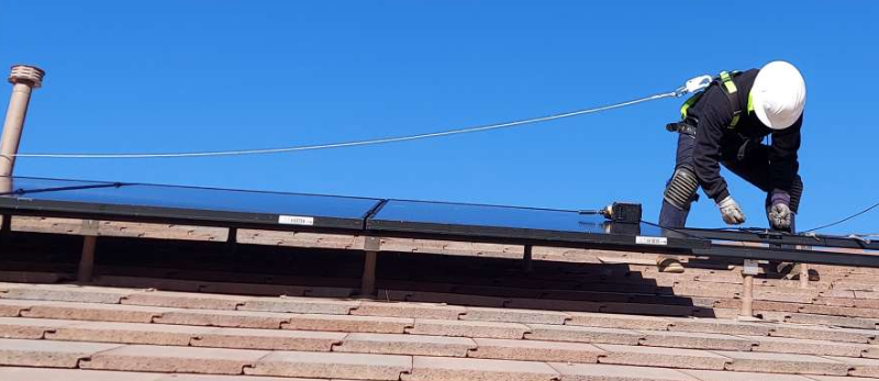 Las Vegas solar technician from Cooper Roofing & Solar installing solar on a home in Las Vegas, Nevada