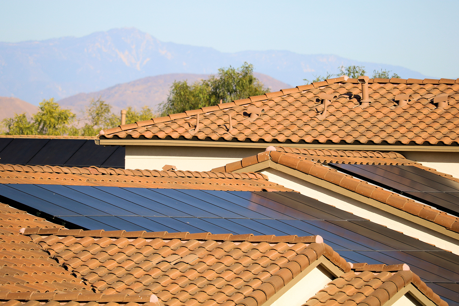 Solar panels on a rooftop of Las Vegas residential buildings creating green alternative energy.